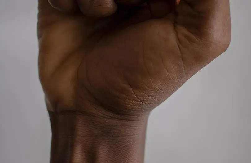 close up of black hand in a fist