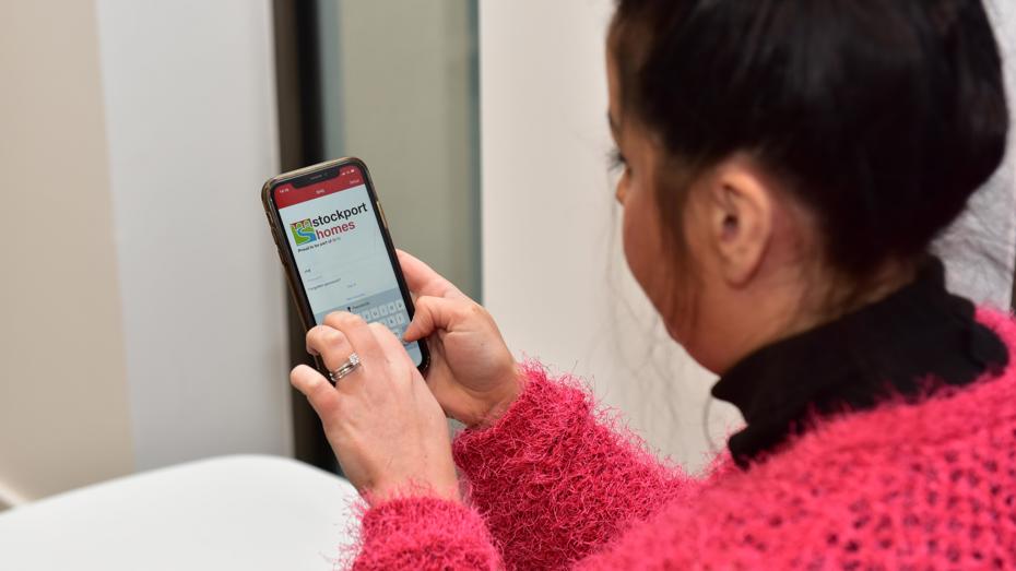 woman on phone app to report ASB