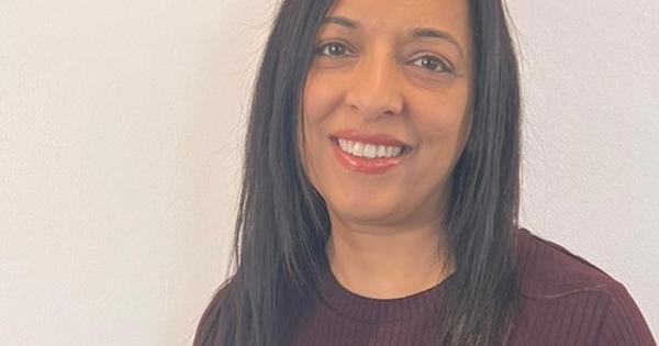 Nasrin Fazal wearing a purple shirt