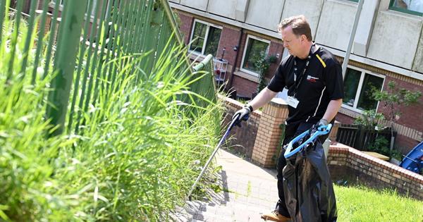 Caretaker Picking Up Litter