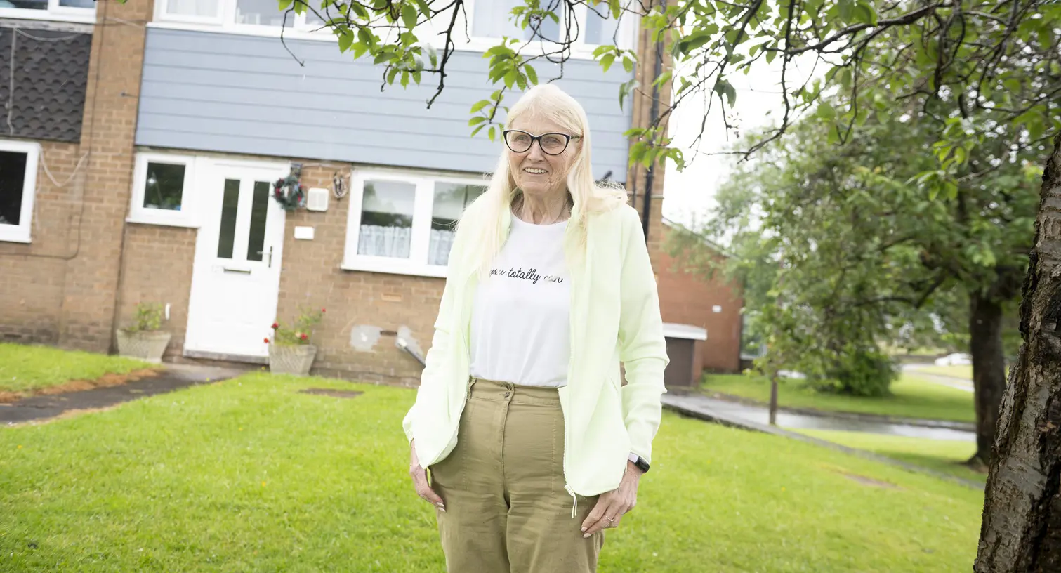 Female Stood Outside House