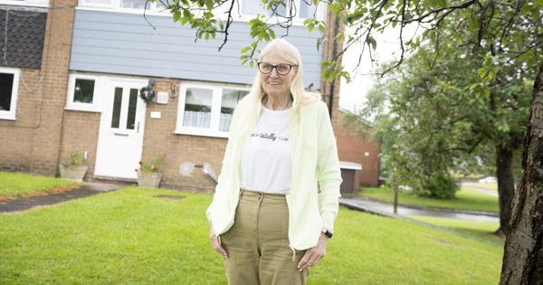 Female Stood Outside House