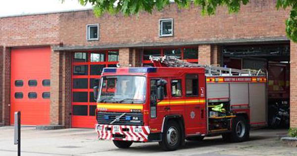Fire Engine coming out of a fire house