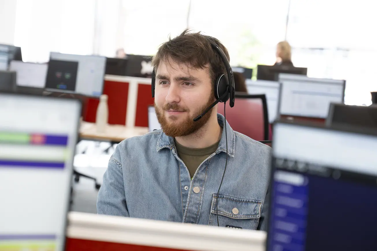 Male With Head Set On In Office