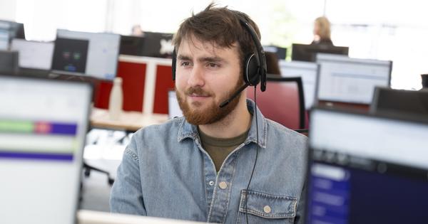 Male With Head Set On In Office