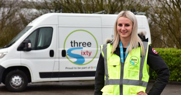 Woman in a hi-viz in front of a three sixty branded van