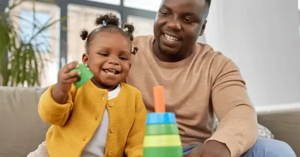 Man and child playing with toys