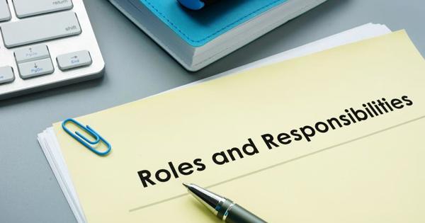 Roles and responsibilities as text on a notepad with a pen on top
