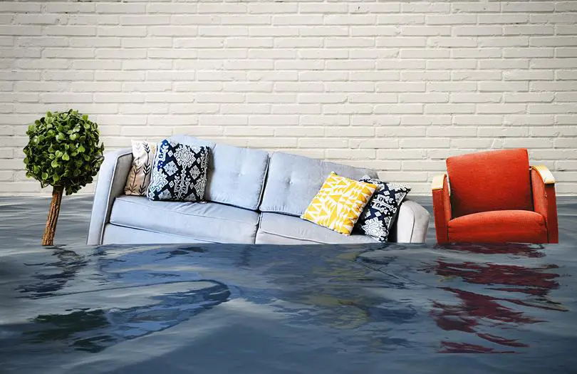 A sofa and chair sinking into water