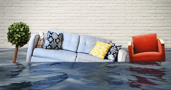A sofa and chair sinking into water