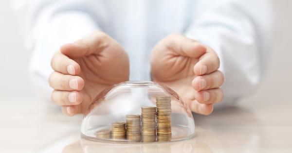hands covering coins