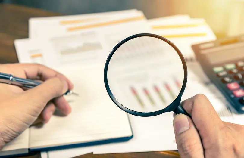 Magnifying glass against paper