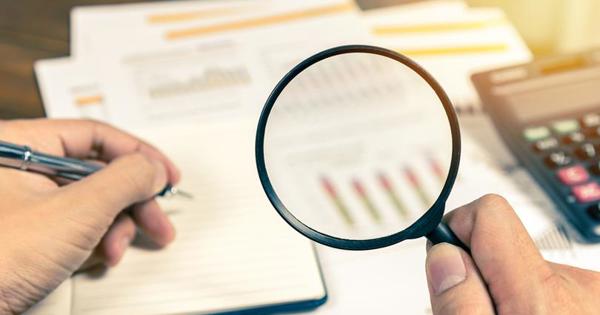 Magnifying glass against paper