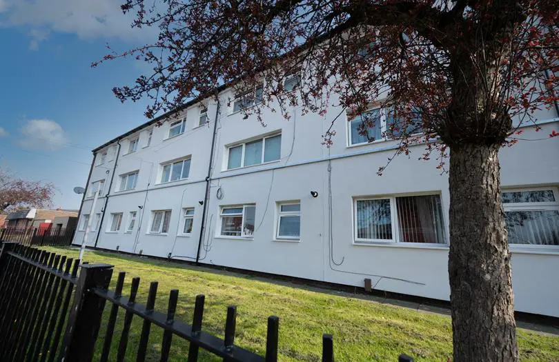 White houses made into flats from the front
