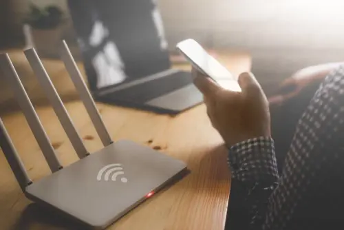 Person At A Desk On A Mobile