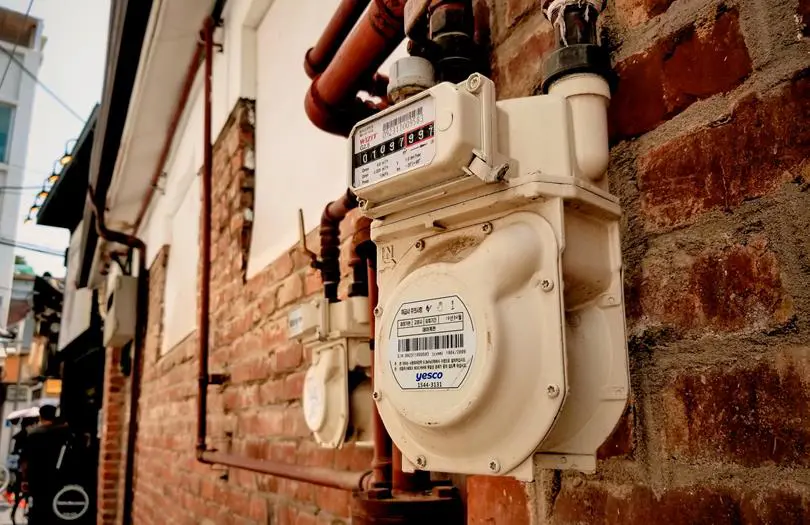 Water meter outdoor at the side of a house