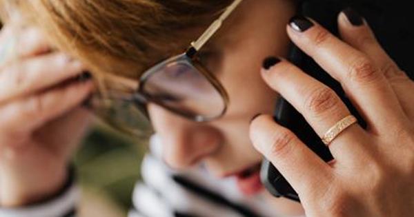 Woman looking distressed on the phone