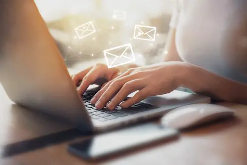 Women Typing On Laptop