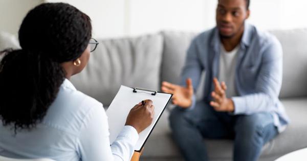 Female With Clipboard Talking To Man