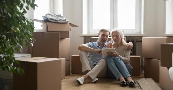 happy couple in a house with cardboard boxes