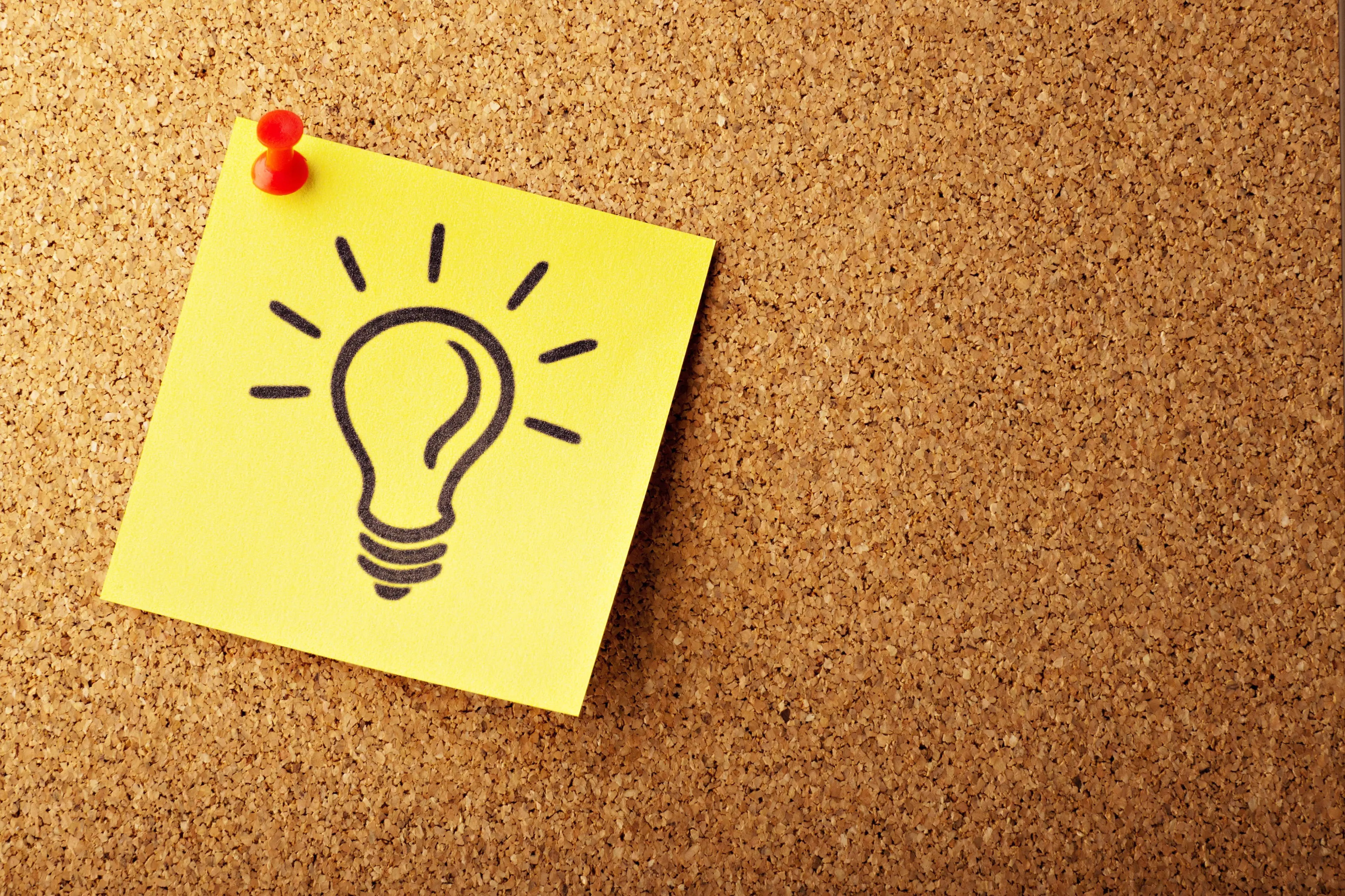 Light bulb on a postnote 