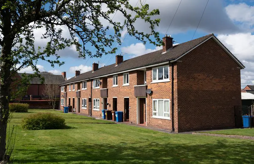 row of houses with flats inside from garden view