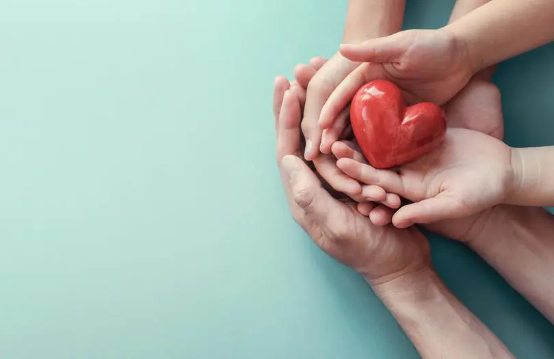 hands holding red heart
