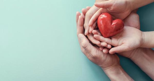 hands holding red heart