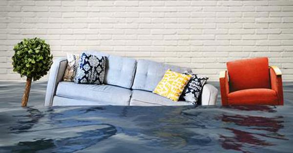 A sofa and chair sinking into water
