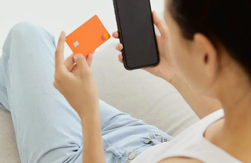 A woman Paying on phone