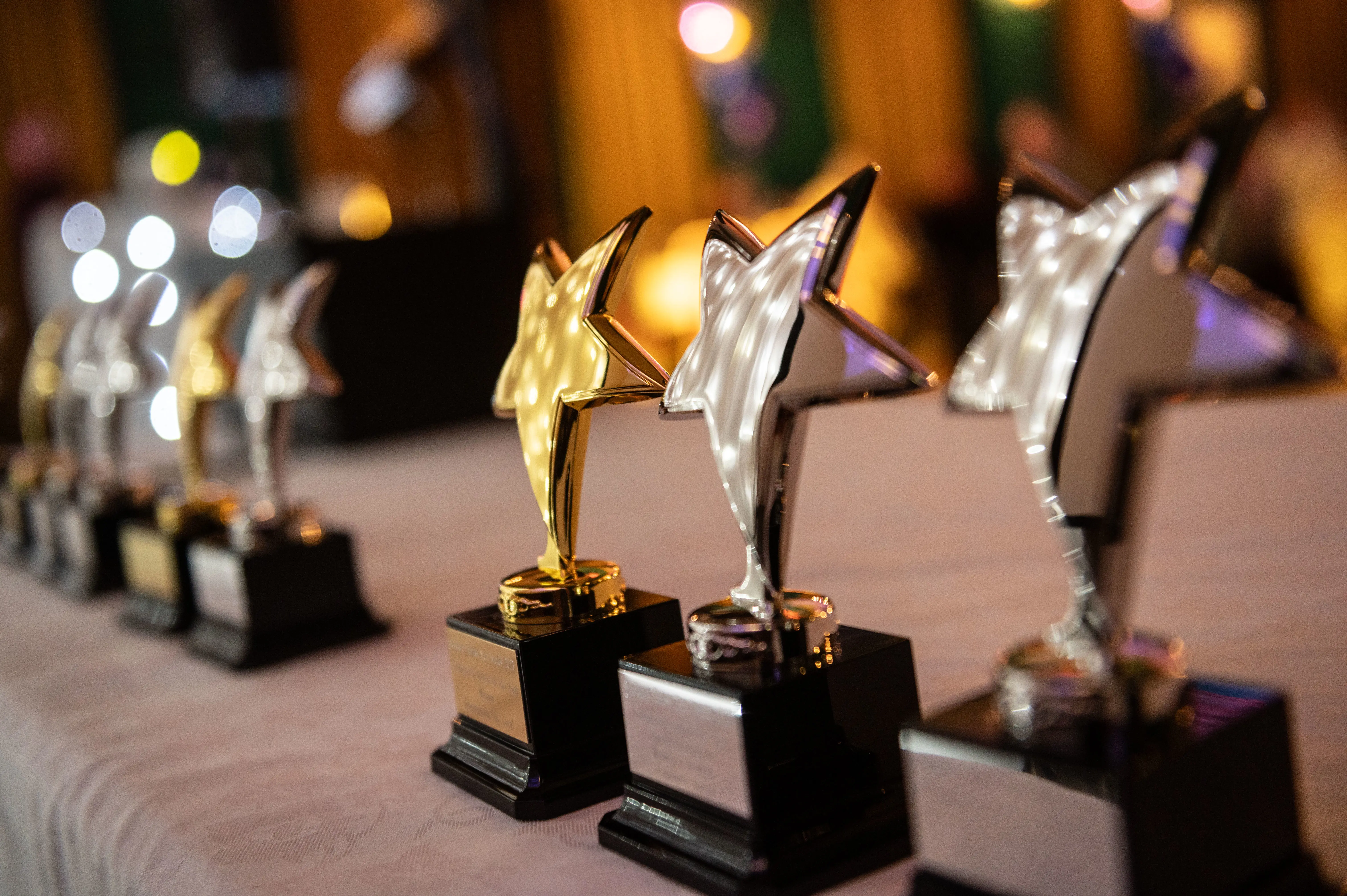 award trophies with stars in a line