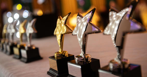 award trophies with stars in a line