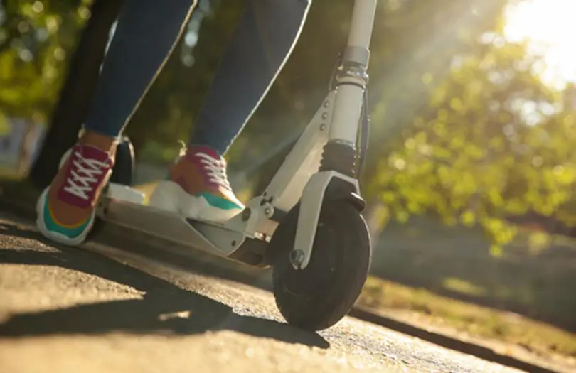 A person riding an electric scooter