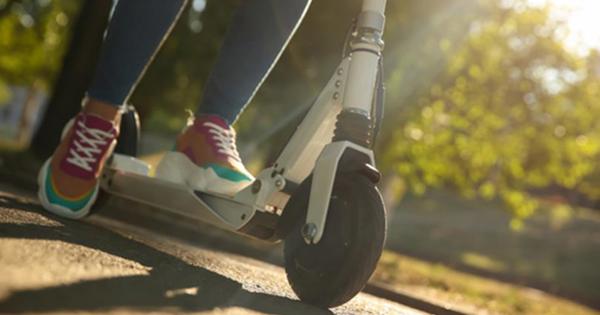 A person riding an electric scooter
