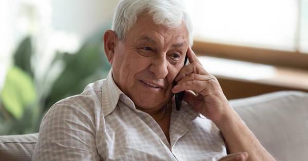 Older Man In Home on a mobile phone