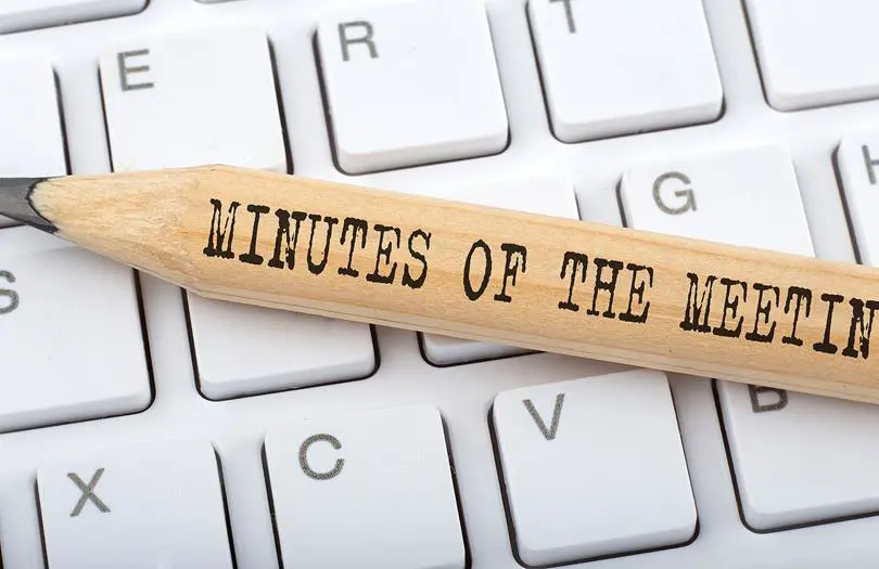 Minutes of meeting words on a pencil