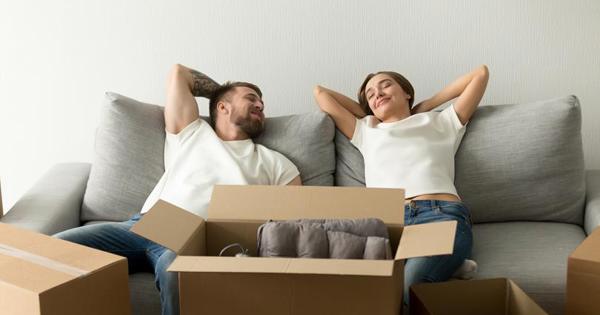 Woman and man lying down on a sofa