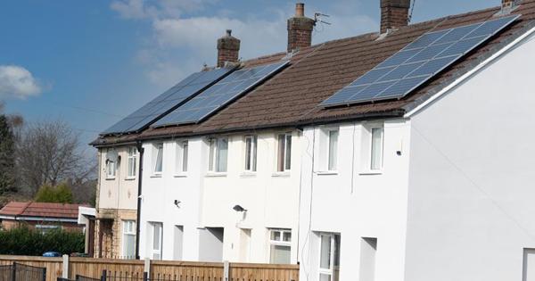 white houses in a row with solar panels
