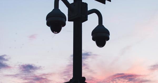 CCTV on a lamppost against the sky