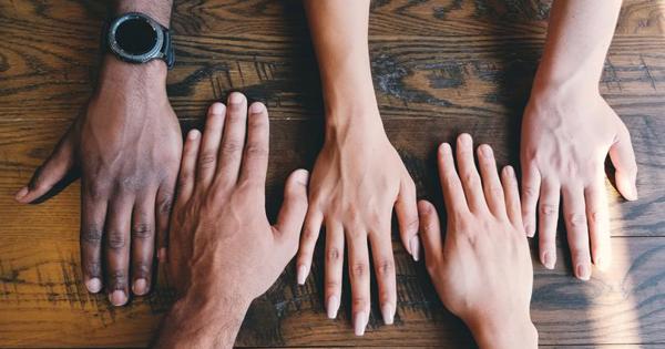 A range of different coloured hands lined up next to each other