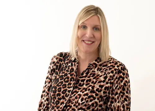 headshot of Alison Foster wearing a leopard print shirt