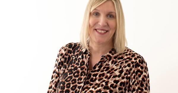 headshot of Alison Foster wearing a leopard print shirt
