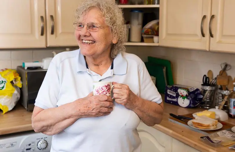 Older woman smiling in home