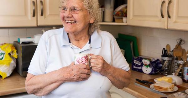 Older woman smiling in home