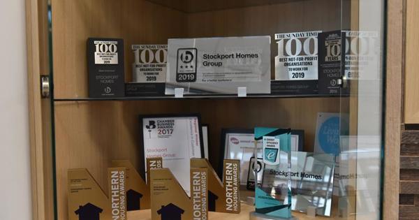 collection of awards in a trophy cabinet