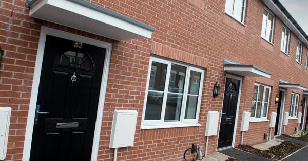 front view of a new build home with a black door