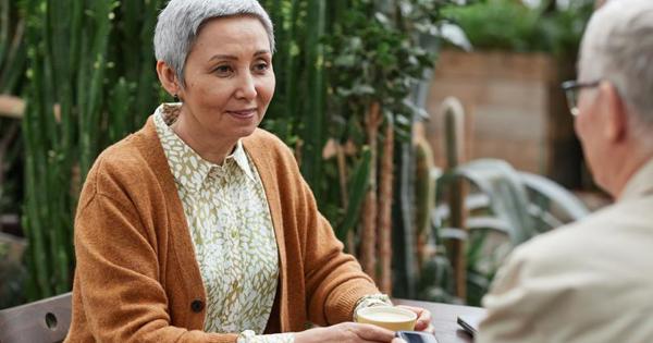 older woman speaking to man