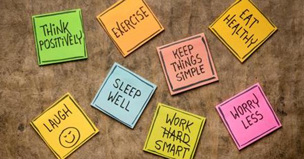 Written notepad with ideas on how to improve Health And Wellbeing