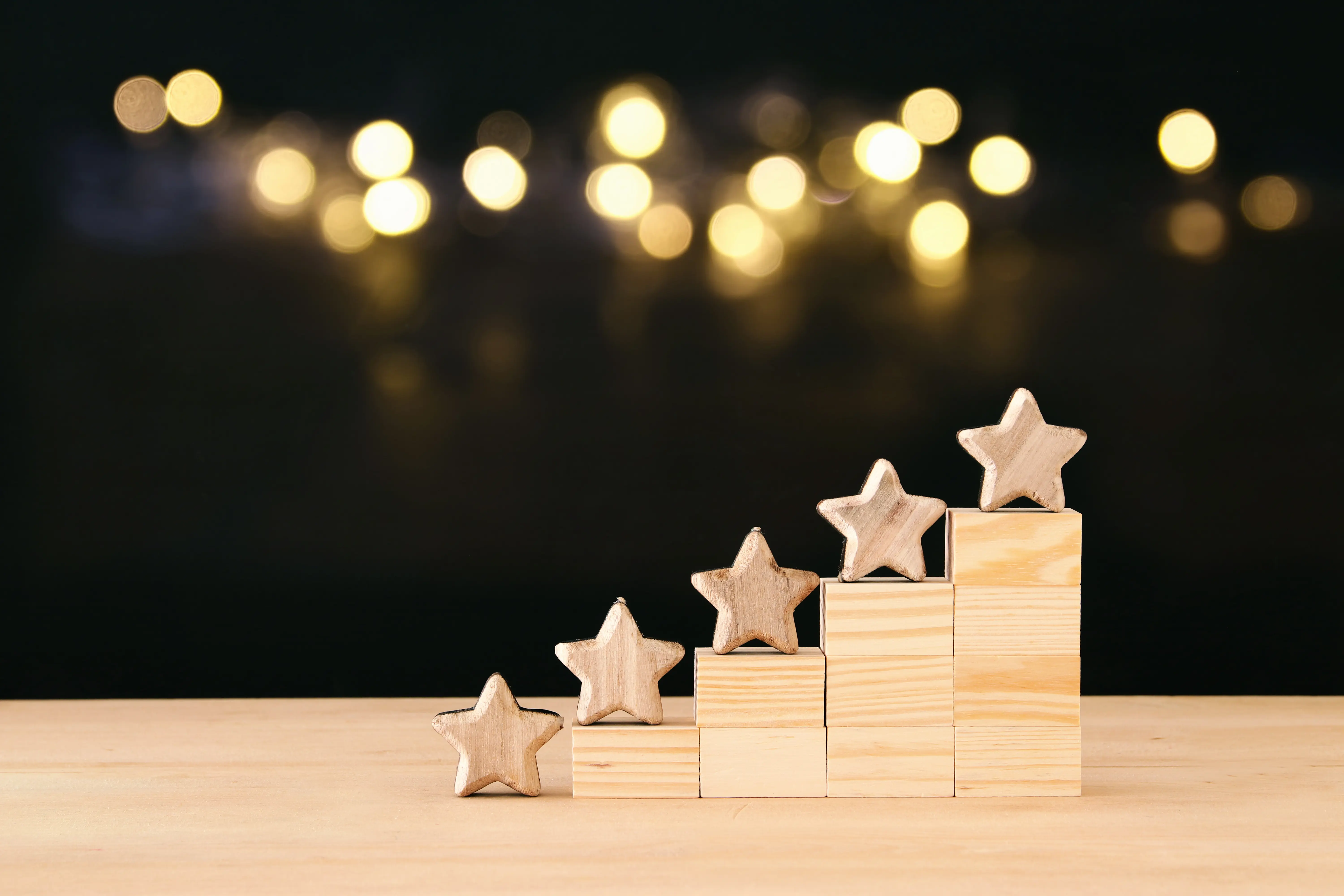 wooden stars along a table