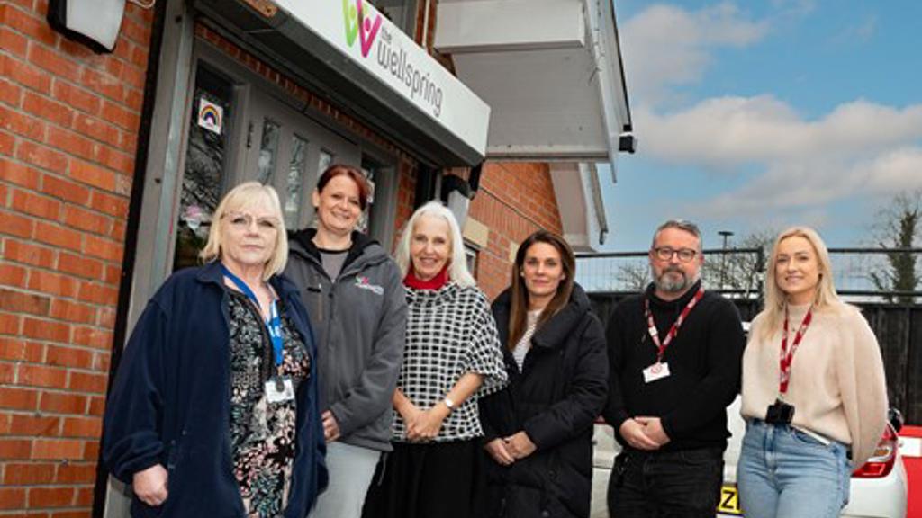 Group photo outside the Wellspring charity